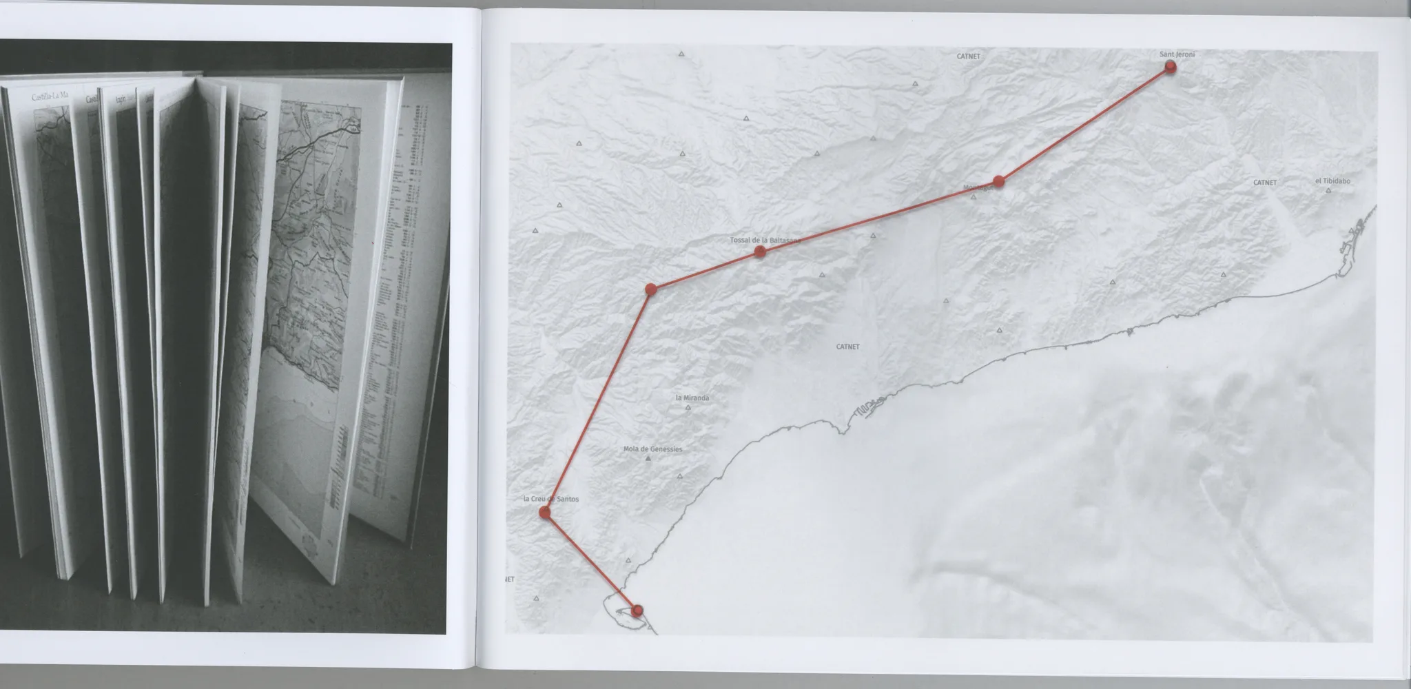 Book spread with folded map pages and a hand-drawn route on a topographic map of Catalonia